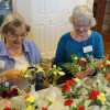 Resident Volunteers Creating Flower Centerpieces